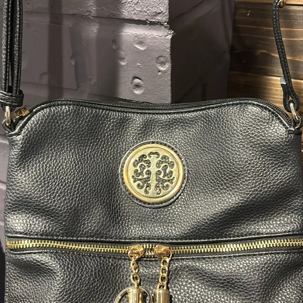 Rebecca & Rifka Black Adjustable Crossbody Bag with Tassel Zipper Detail
